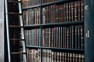 Books on shelf in library.